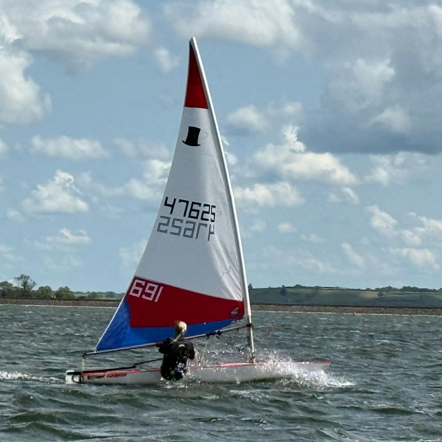 Faith's Topper on the water